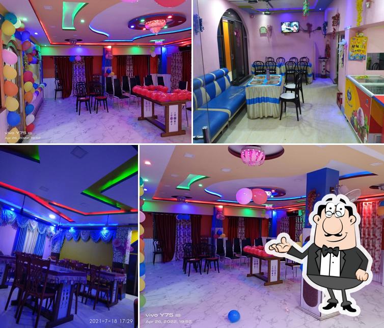 Take a seat at one of the tables at Ashirbaad Family Restaurant