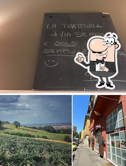 Questa è la foto che mostra la esterno e lavagna di Trattoria di Via Serra