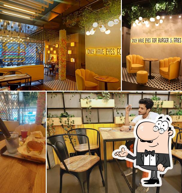 Take a seat at one of the tables at The Burger Bros