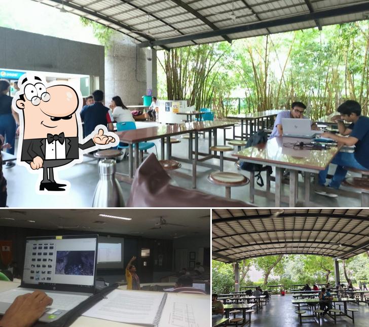 Take a seat at one of the tables at Pharma Canteen Nirma University( Shree Aadhya Foods)