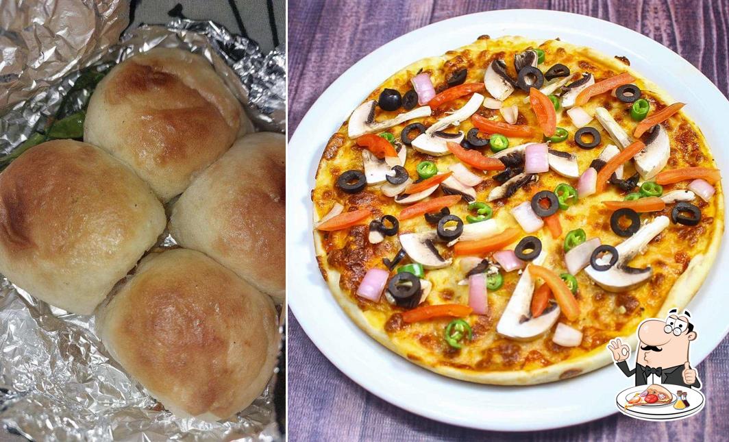 Try out pizza at Satguru Vada Pav & Fast Food