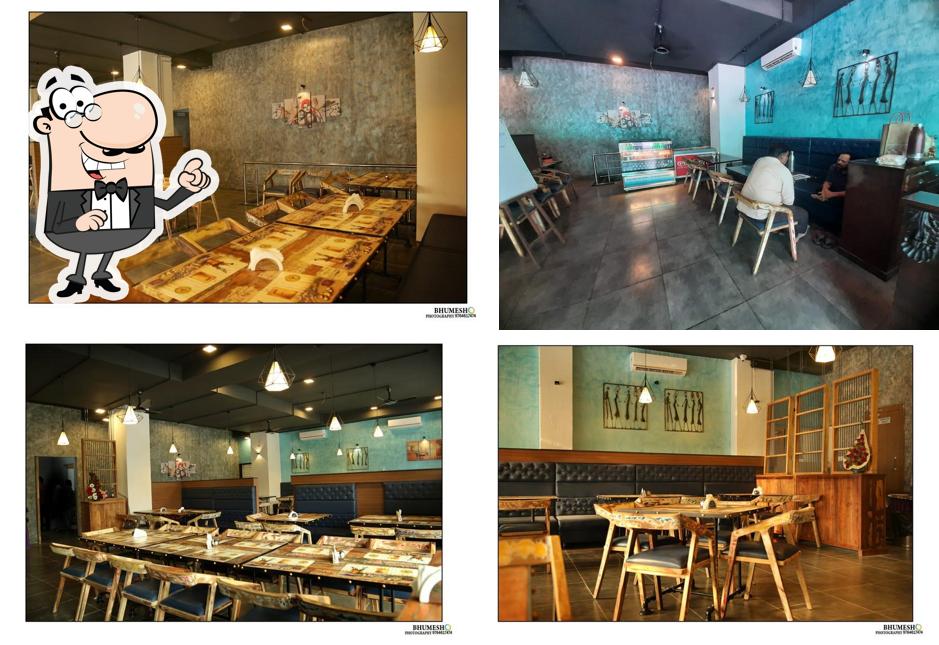 Take a seat at one of the tables at Hotel Visawa Cafe Park