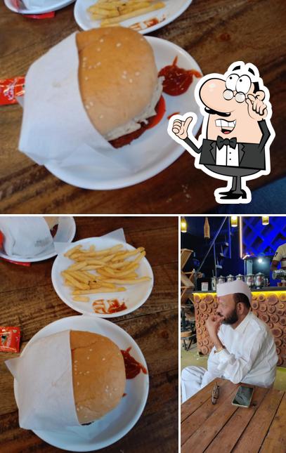 Take a seat at one of the tables at BURGER POINT