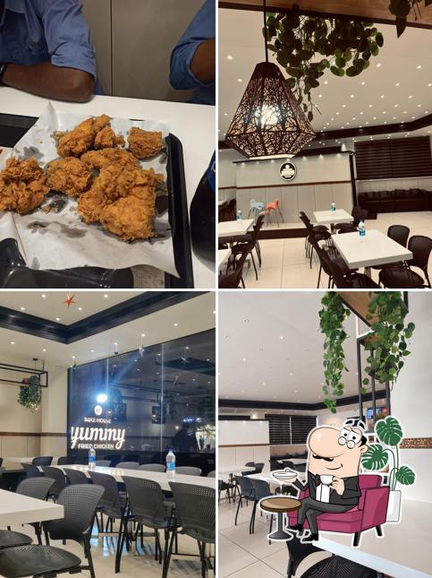 Take a seat at one of the tables at Yummy Fried Chicken Karaparamba