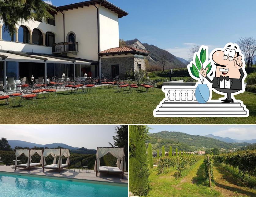 Puoi goderti l'aria fresca da seduto all'esterno di Resort Podere Castel Merlo