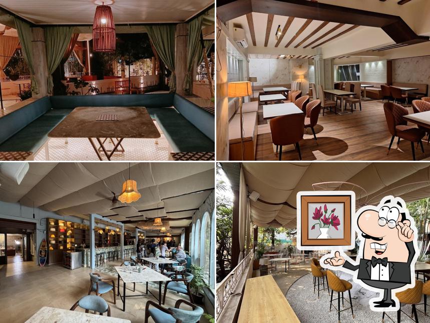 Take a seat at one of the tables at Global Village Multi-Cuisine Restaurant