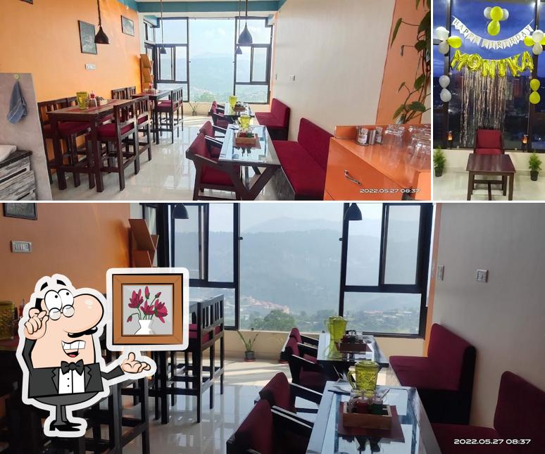 Take a seat at one of the tables at Mangalmurti Himalayan Restro & Cafe