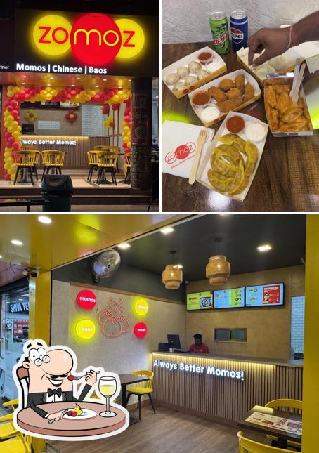 The photo of food and interior at ZOMOZ - The Momo Company