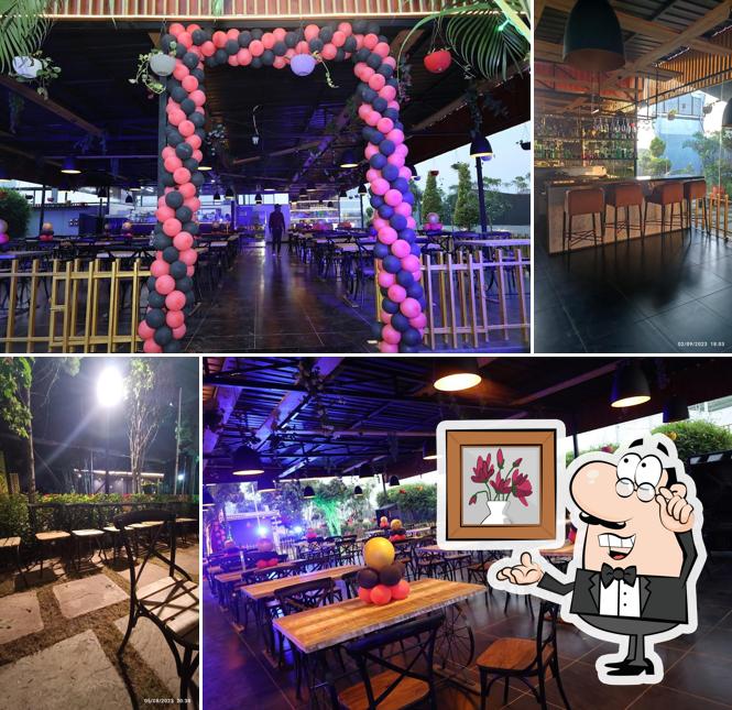 Take a seat at one of the tables at The Elet By Midflight(Family Garden and Restaurant)
