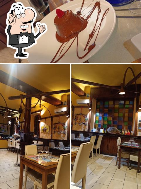 Pescheria Degli Artisti Albissola Marina si caratterizza per la interni e cibo