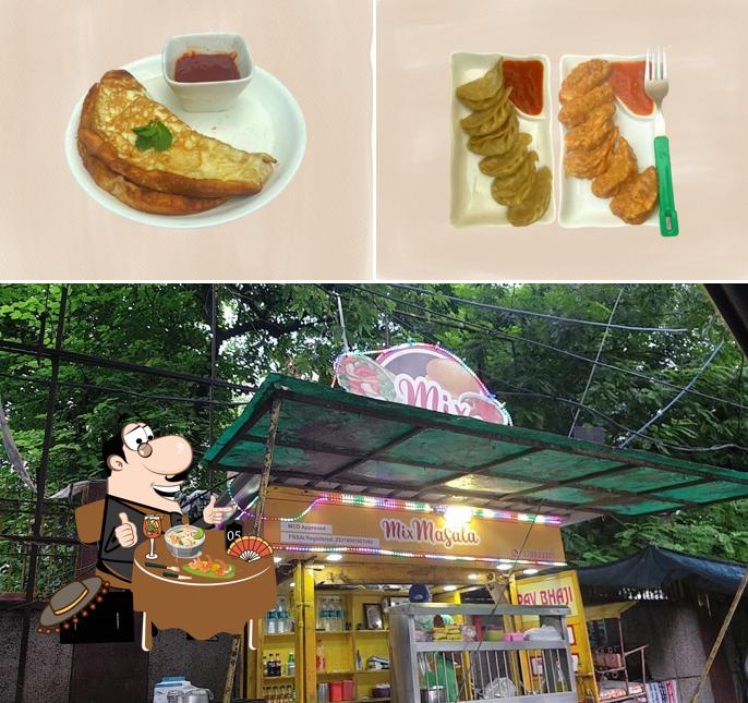 Take a look at the image showing food and interior at Mix Masala