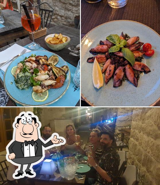 Questa è la immagine che raffigura la interni e bevanda di Konoba Bunar