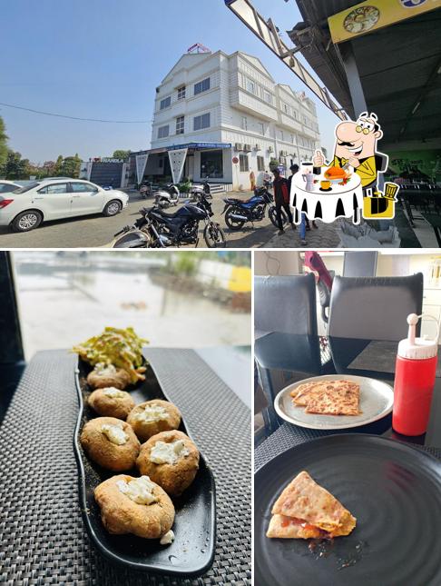 The photo of Hotel Anmol Pure Veg Restaurant’s food and exterior