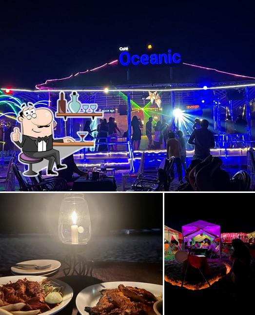 Check out the photo showing interior and food at Cafe Oceanic Beach Shack