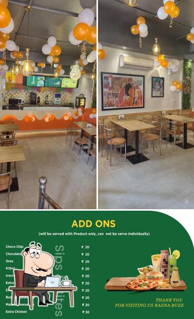 Check out the photo depicting interior and food at RasnaBuzz Agra