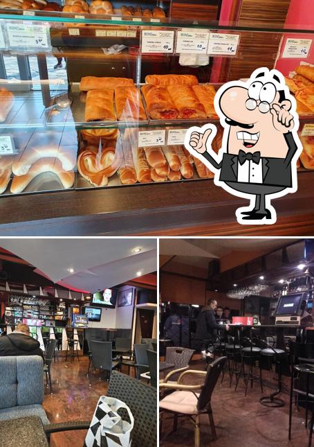 Questa è la immagine che raffigura la interni e cibo di Santa Lucija Caffe Bar