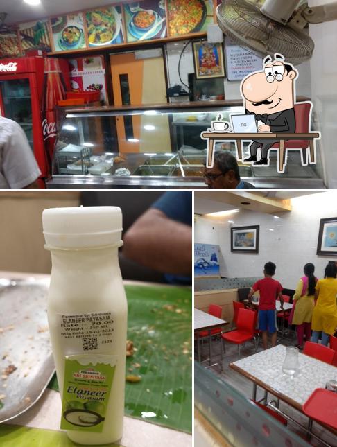 Take a seat at one of the tables at Perambur Sri Srinivasa Sweets & Snacks