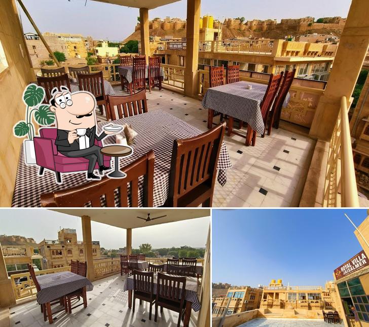 Take a seat at one of the tables at Zaffran Restaurant & Cafe Jaisalmer