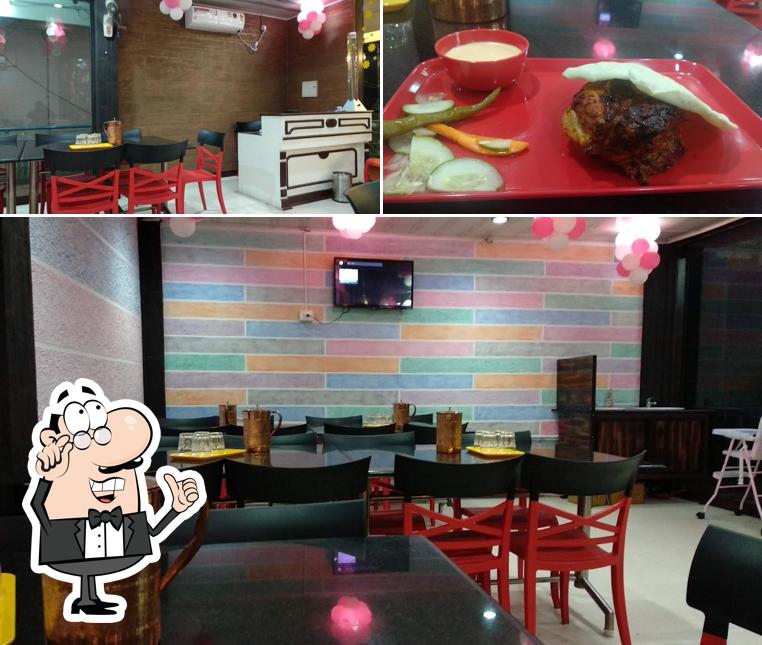 The picture of interior and burger at Malabar Hotel (Kochi)