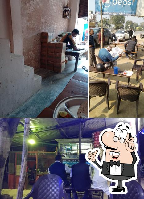 Take a seat at one of the tables at BABA Dhaba (baba nagar khaga)