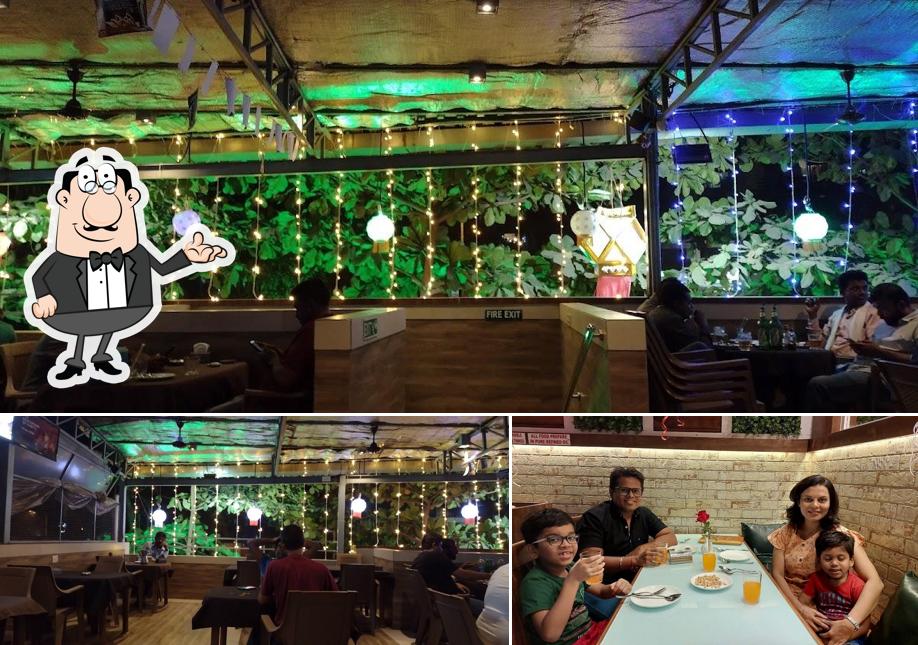 Take a seat at one of the tables at Neelam Family Restaurant and Bar - Waghbil