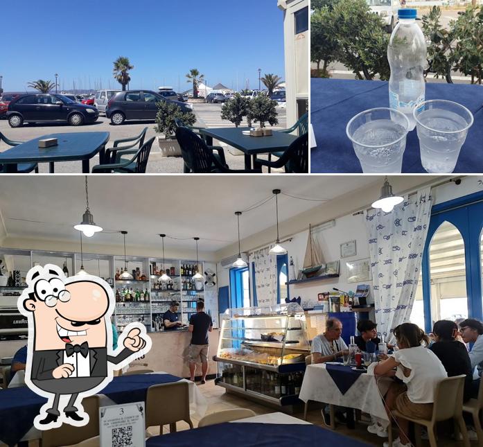 La foto di interni e bevanda da Pizzeria Il Veliero