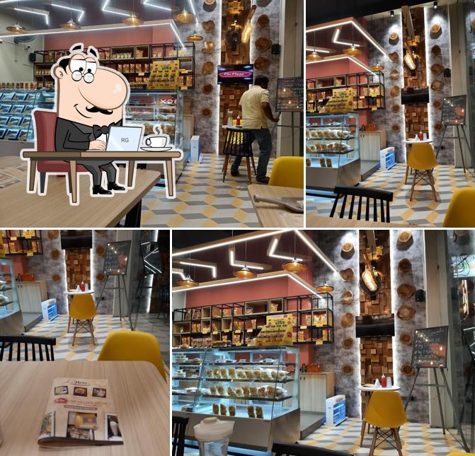 Take a seat at one of the tables at SNACKS BOX