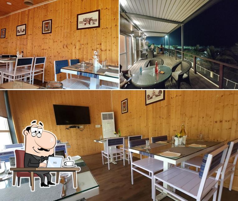 Take a seat at one of the tables at Nimantran
