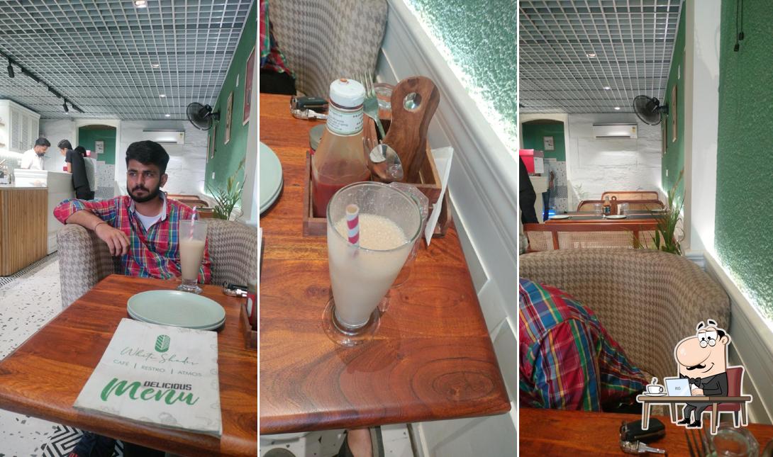 Take a seat at one of the tables at White Shade Cafe