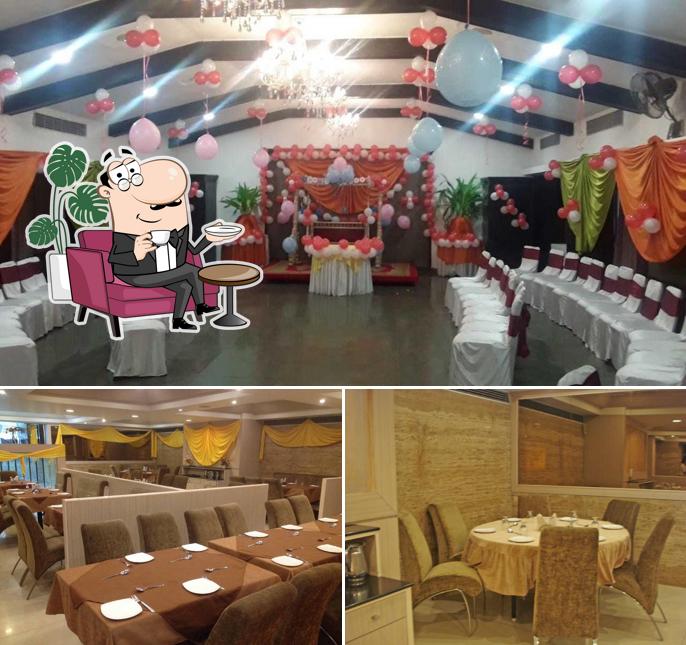 Take a seat at one of the tables at Woodlands Restaurant