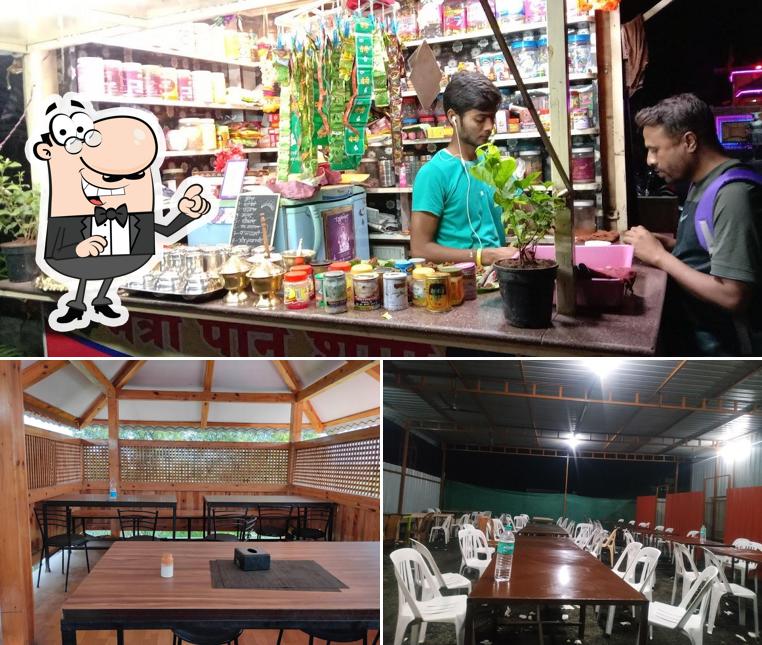 Take a seat at one of the tables at Maitri Restaurant & Lawns