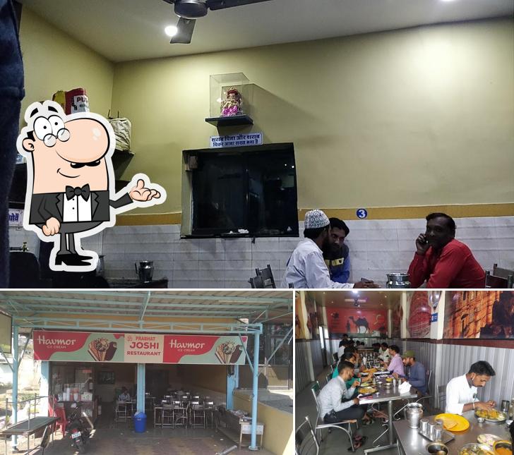 Take a seat at one of the tables at Om Prabhat Joshi family Restaurant & dhaba