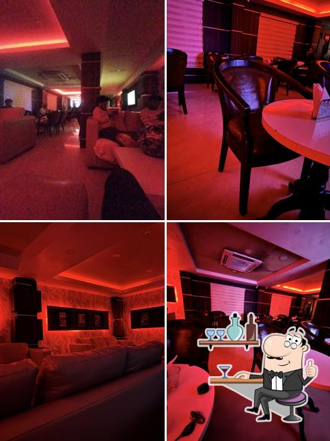 Take a seat at one of the tables at Kings Empire Executive Lounge Bar