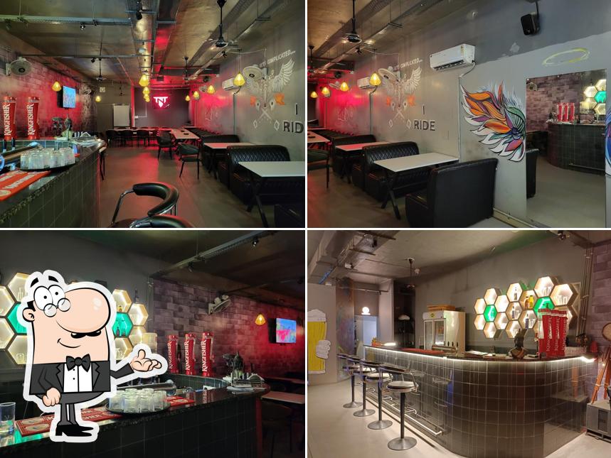 Take a seat at one of the tables at Torque N Tonic - TNT Pub and Restaurant