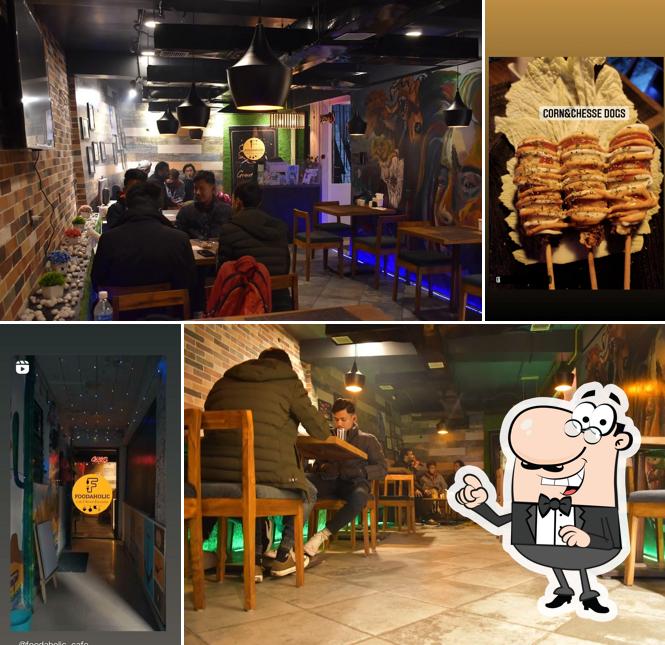 Take a seat at one of the tables at Foodaholic Cafe