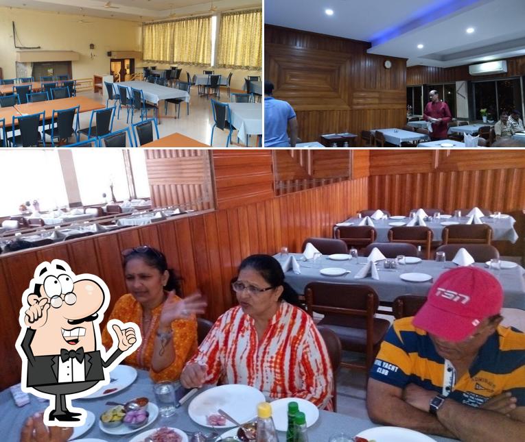 Take a seat at one of the tables at Kwality Restaurant