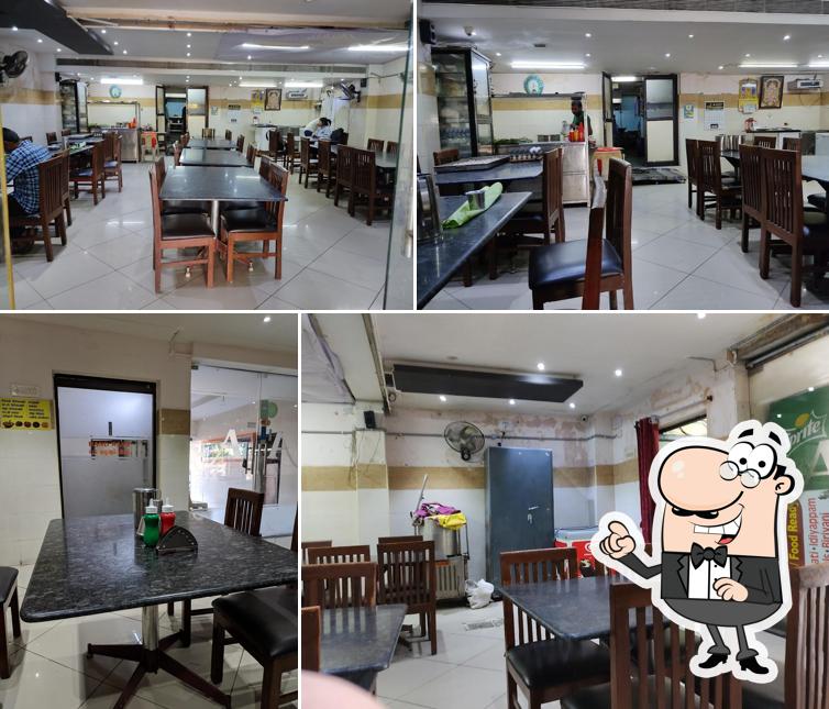 Take a seat at one of the tables at Hotel Annapoorna