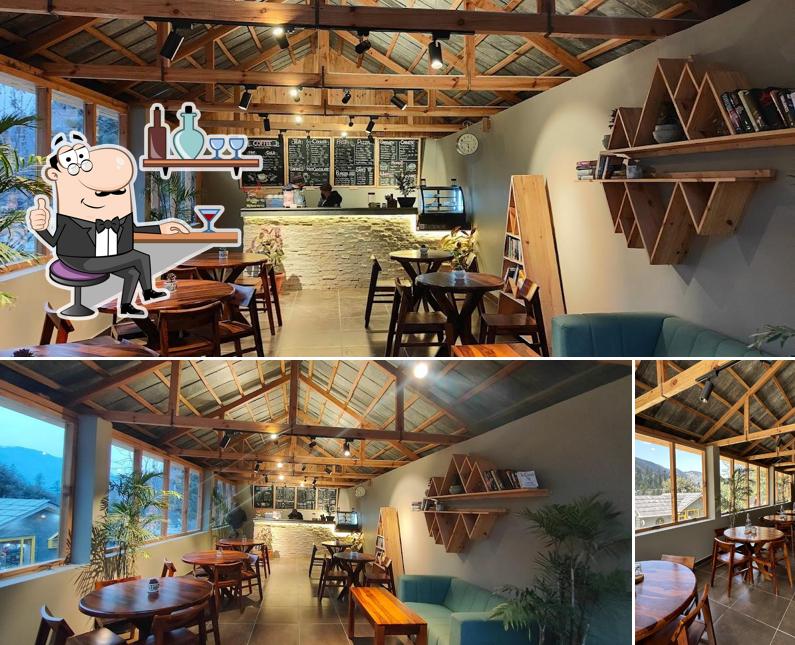 Take a seat at one of the tables at Jibhi forest bean coffeehouse & bistro