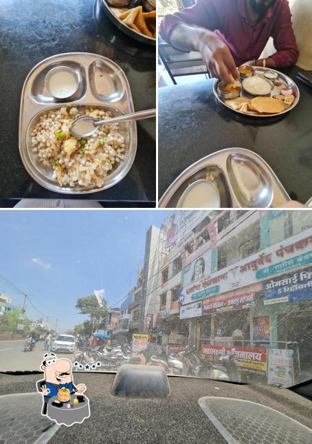The photo of food and exterior at Hotel Tirumala