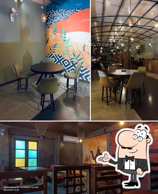 Take a seat at one of the tables at Shawaya city