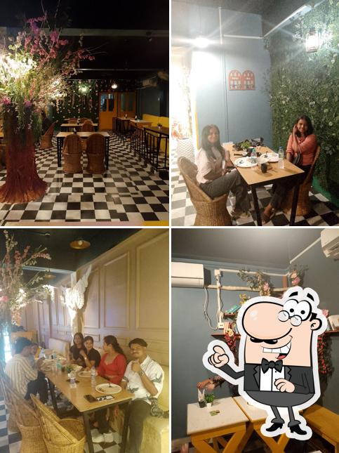 Take a seat at one of the tables at Cafe De Roma