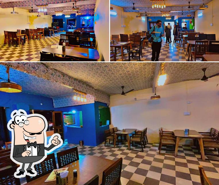 Take a seat at one of the tables at Desert Dinning Restro