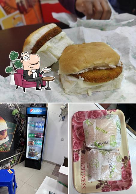 Check out the image displaying interior and food at Goli Vada Pav