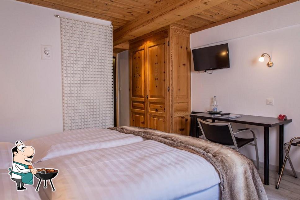 Prenditi i un pasto a base di carne a Hôtel - Restaurant Alpina