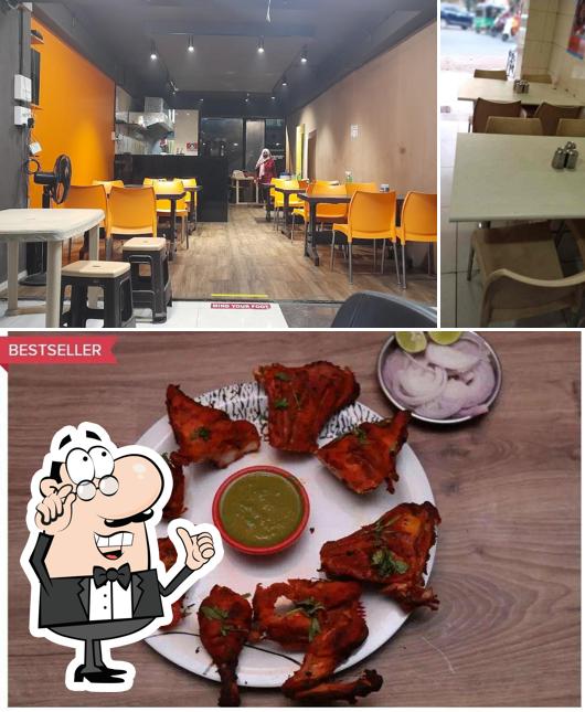 Check out the picture showing interior and food at PD restaurant
