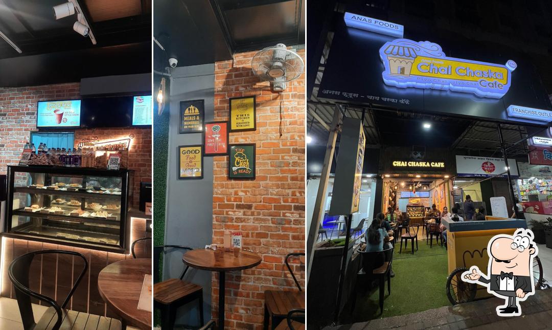 Take a seat at one of the tables at Chai Chaska Cafe - Chinchwad