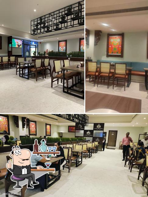 Take a seat at one of the tables at SHREE TATVA PURE VEGETARIAN RESTAURANT AND