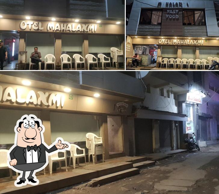 Take a seat at one of the tables at Hotel Mahalaxmi