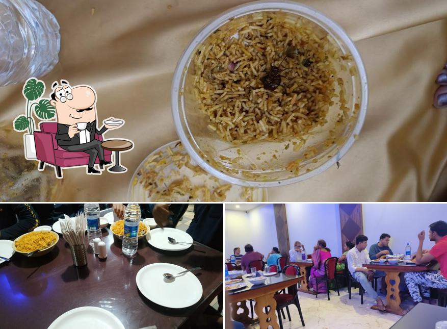 This is the photo displaying interior and food at Harekrishna AC Veg Restaurant