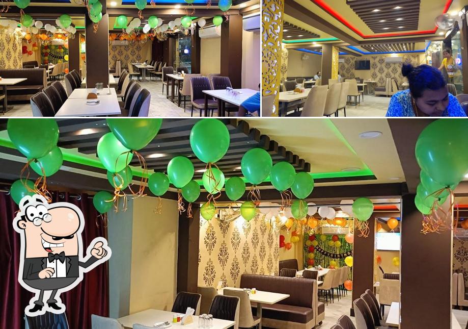 Take a seat at one of the tables at Fusion Delight Restaurant